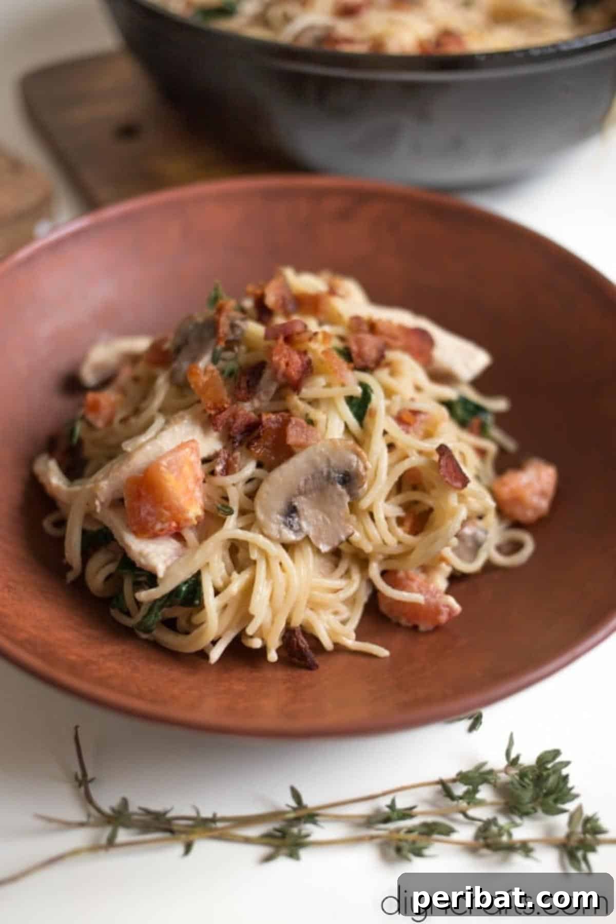 Chicken, Bacon, Spinach Spaghetti: A Modern Classic 7 One serving of chicken, bacon, and spinach spaghetti.
