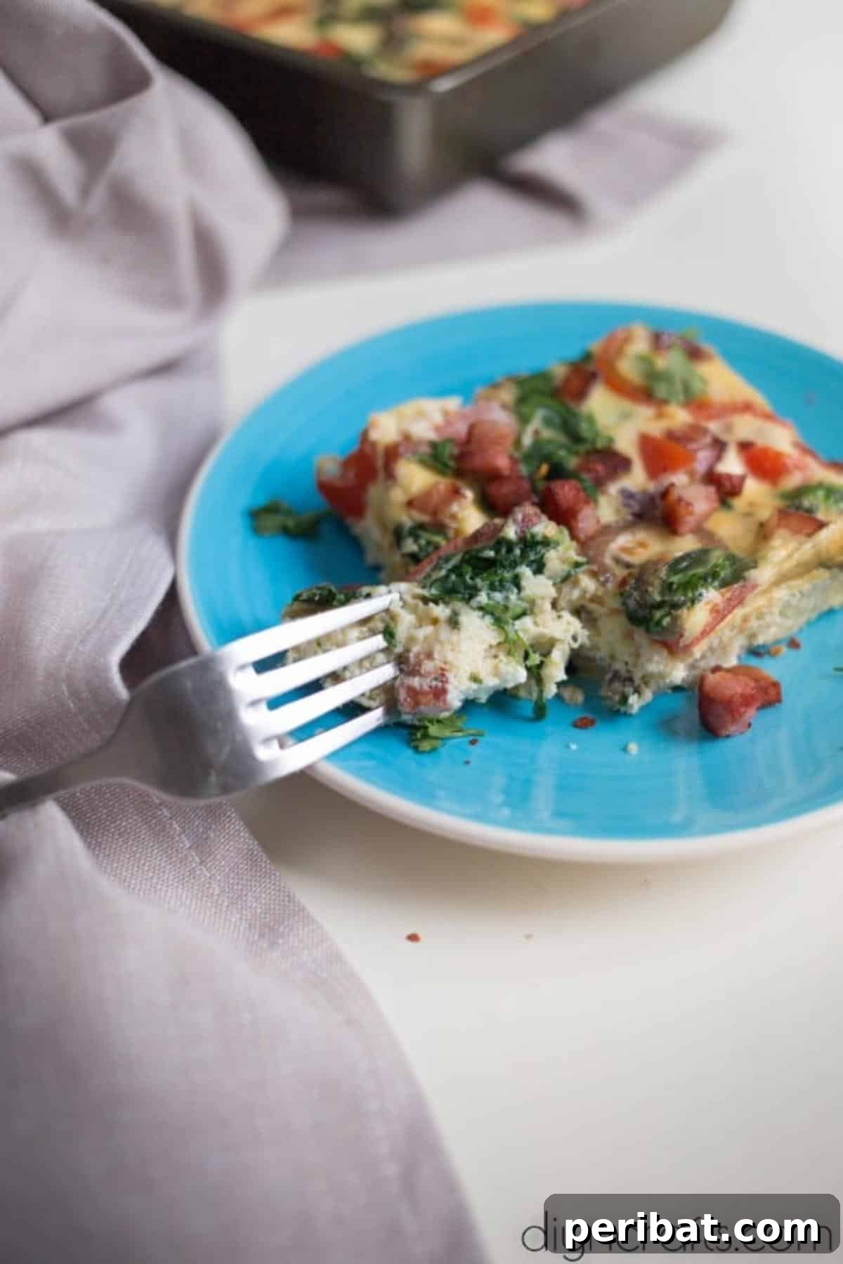 Morning Magic Spinach and Bacon Frittata 7 One portion of spinach bacon frittata on a plate