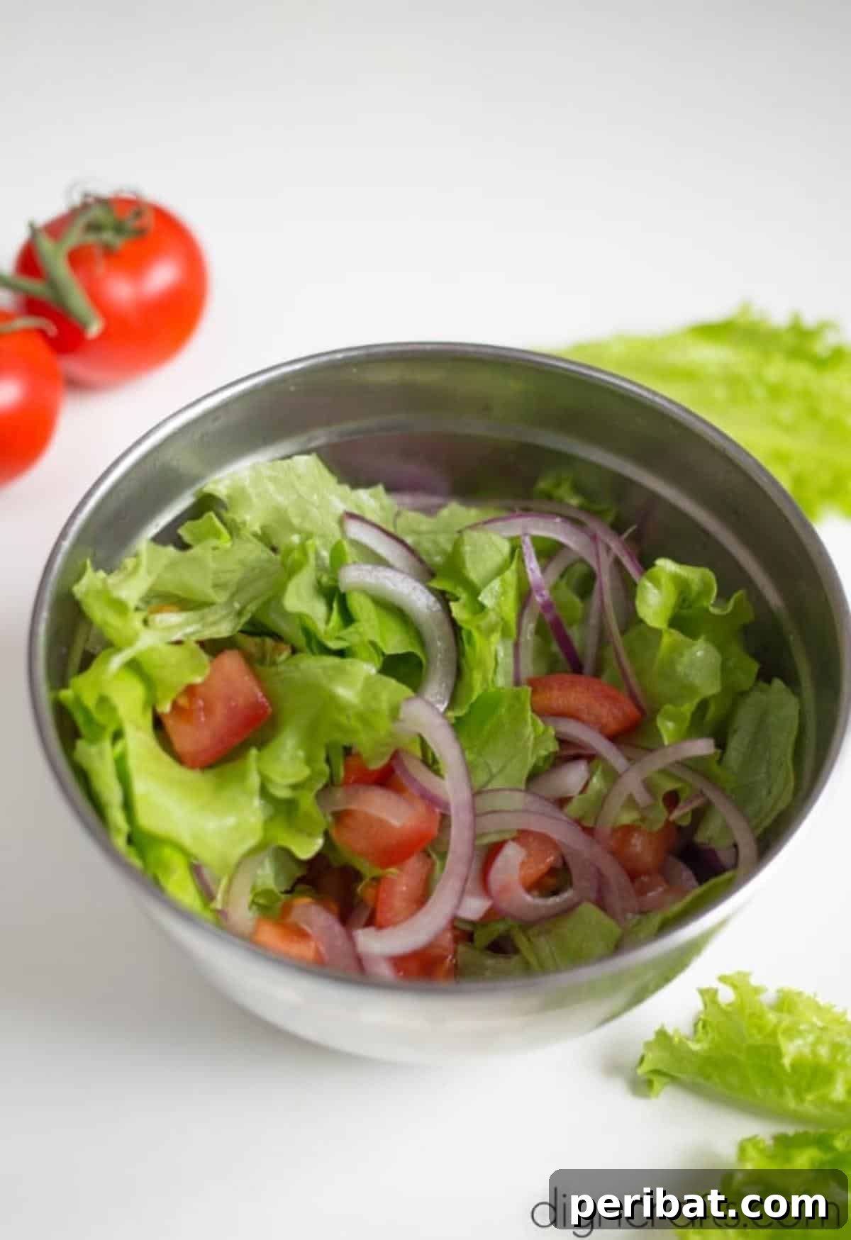 Irresistible BLT Pasta Salad: Recipe Requests Guaranteed 5 Close-up of fresh, colorful salad ingredients like lettuce, tomatoes, and red onion.