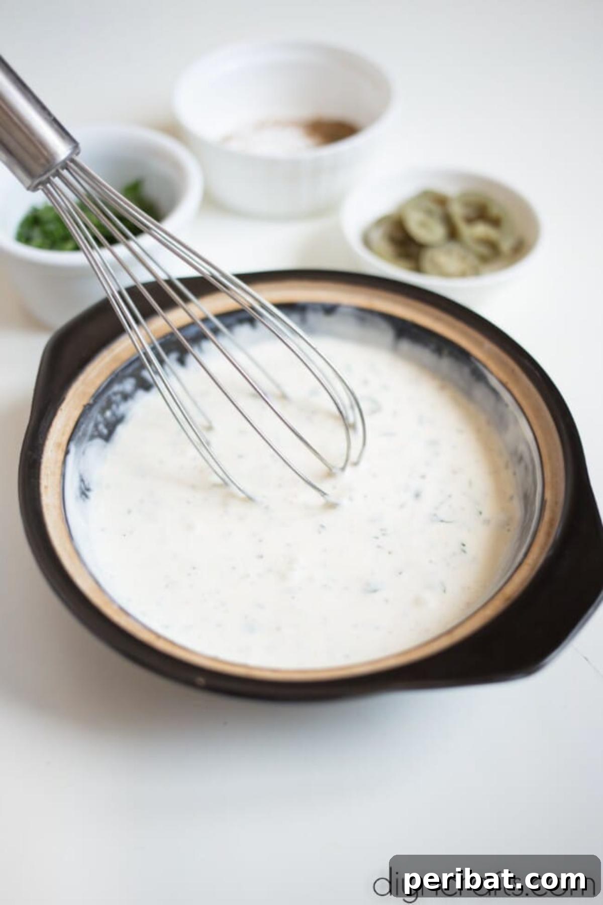 Mixing jalapeno sauce.