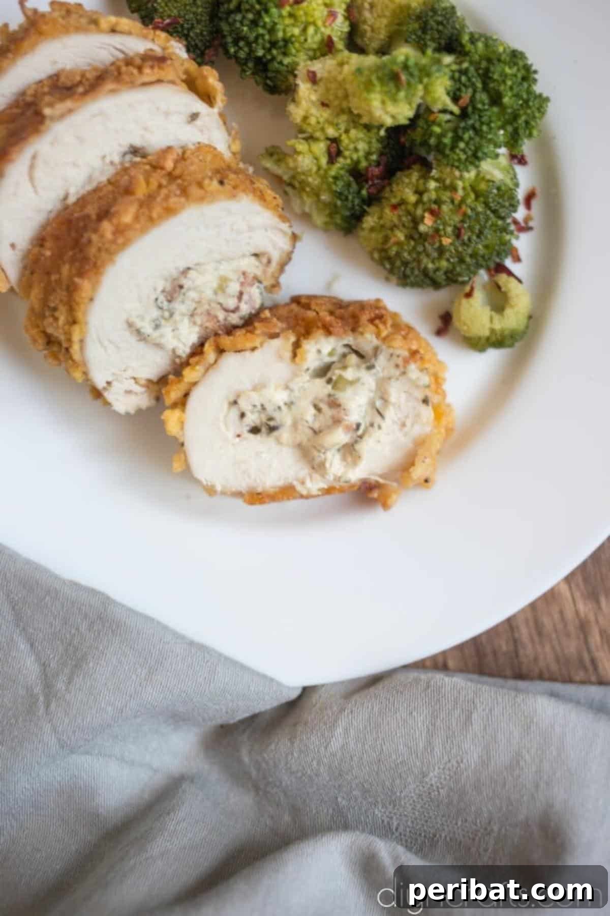 Golden Crispy Bacon and Cheese Chicken Rolls Easy Family Dinner 8 Finished chicken rolls on a plate.