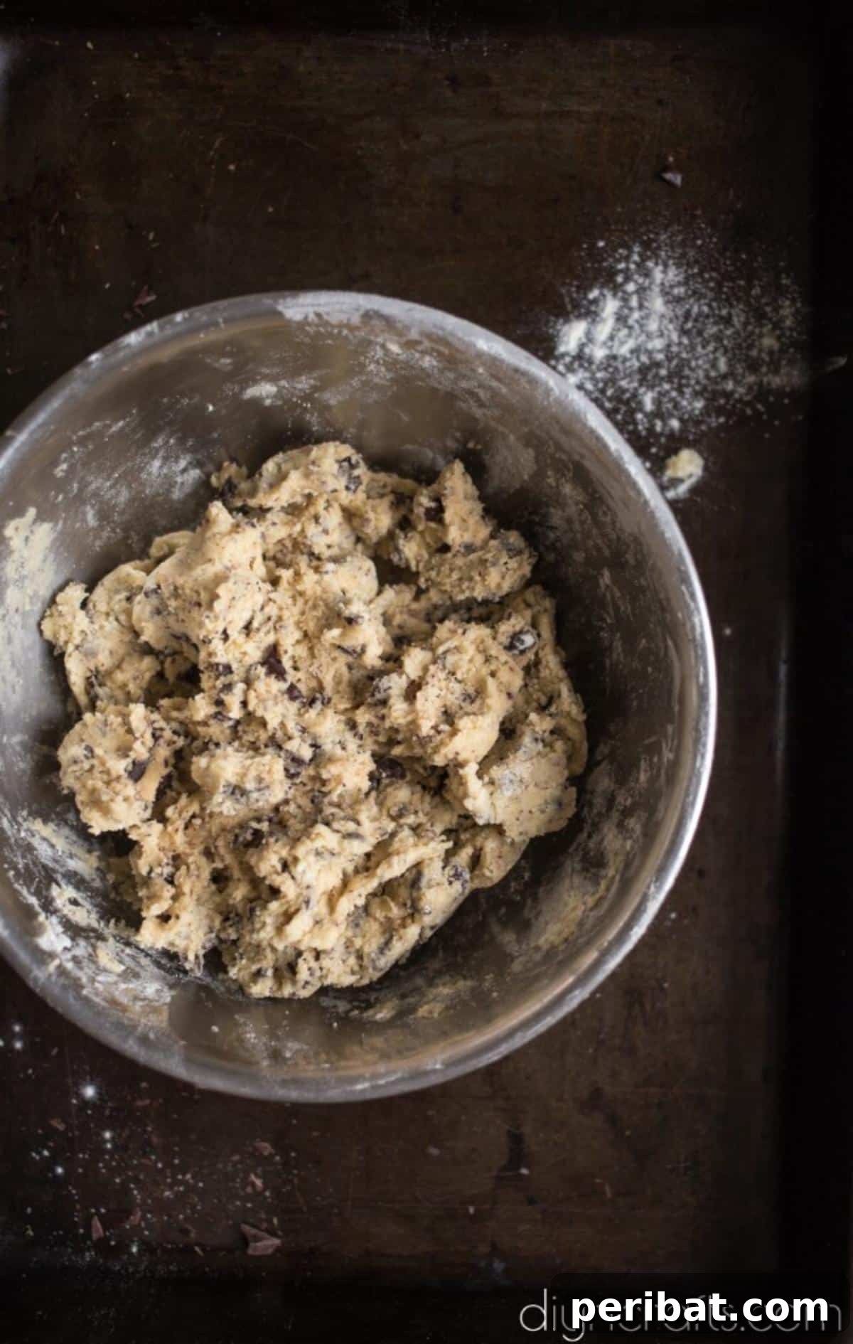Timeless Delight: Effortless Chocolate Chip Cookies 5 Mixing the rest of the ingredients into the dough.