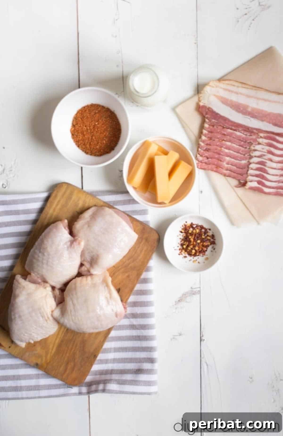 Decadent Bacon Wrapped Cheese Stuffed Chicken Thighs 5 Close-up of the fresh ingredients prepared for the Chicken Thigh Rolls recipe.