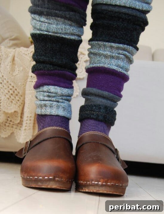 Trendy DIY leg warmers fashioned from old mismatched socks, ideal for layering.