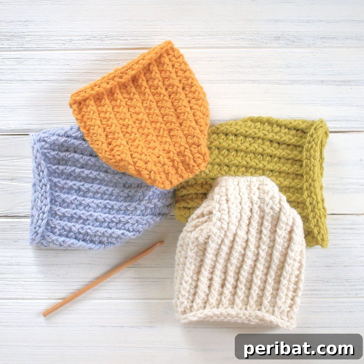 Easy Crochet 120 Free Patterns for Beginners 13 Blue orange cream and green hats stacked together