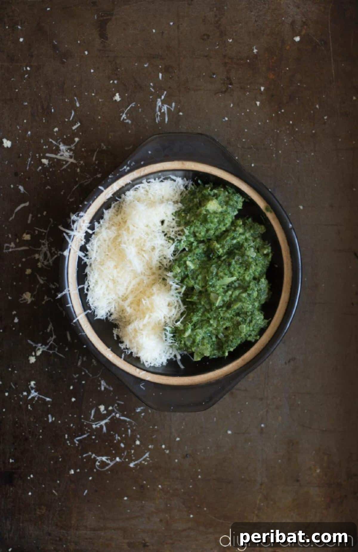 Elevate Your Brunch: Light Salmon Wellington Perfection 4 Close-up of a mixture of fresh spinach and grated parmesan cheese being combined, ready for the filling.