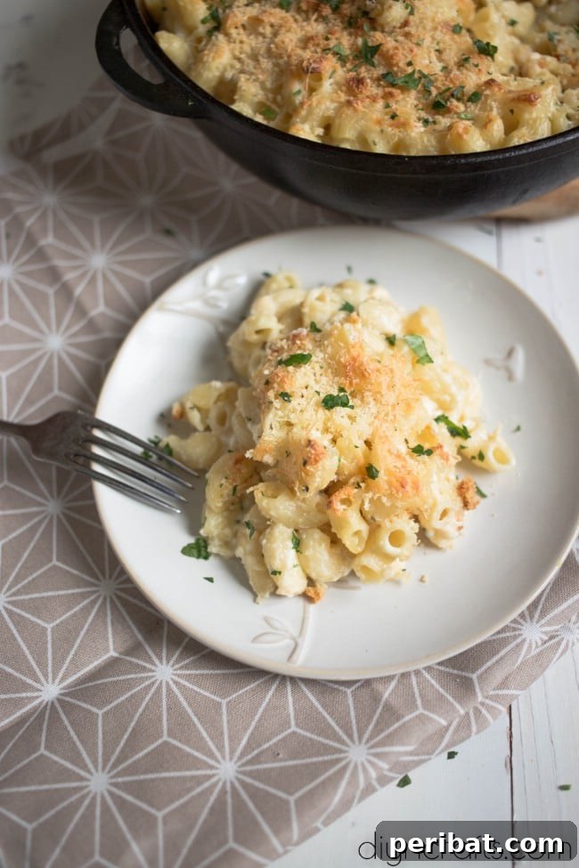 A stunning shot of a finished Million Dollar Mac and Cheese, freshly baked and golden.