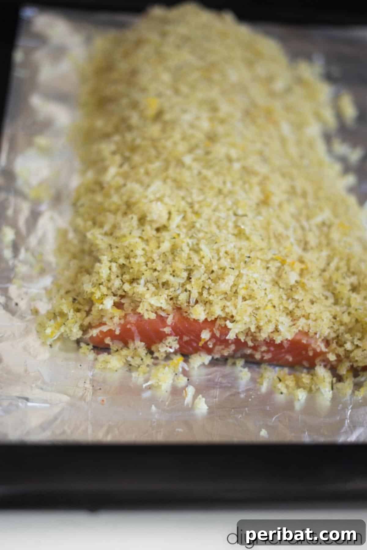 Golden Crispy Garlic Parmesan Salmon Perfection 5 Covering salmon fillets with the stirred ingredients.