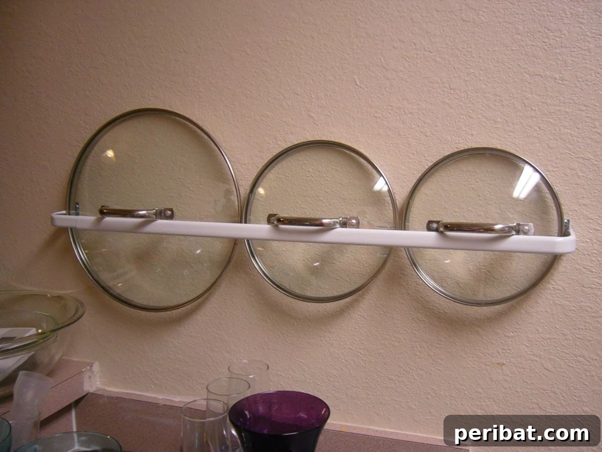 DIY Pot Lid Organizer with a towel rack
