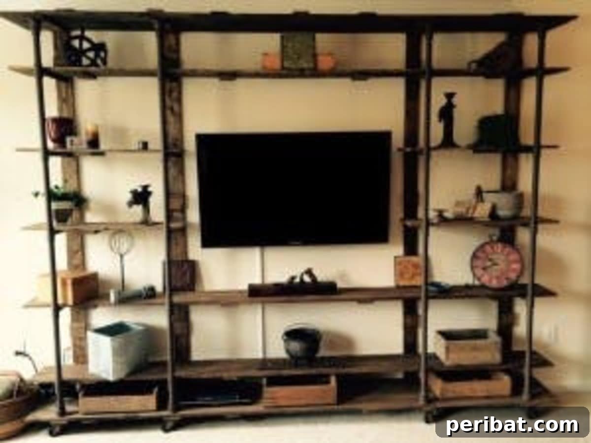 A unique industrial entertainment center crafted from PVC and metal casters, offering a vintage, utilitarian aesthetic.