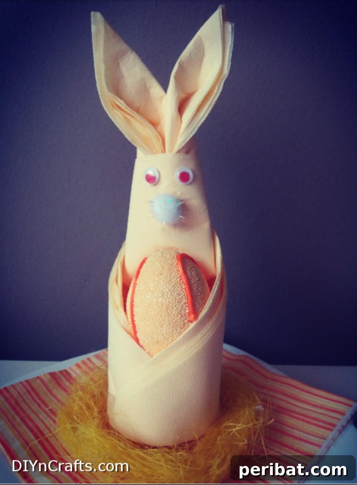 Effortless Adorable Easter Bunny Napkin Place Settings 12 Finished Easter bunny napkin place setting with bunny in basket on a plate.