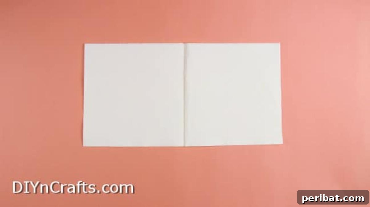 Effortless Adorable Easter Bunny Napkin Place Settings 3 Folding a rectangle napkin to define center lines for the origami bunny.