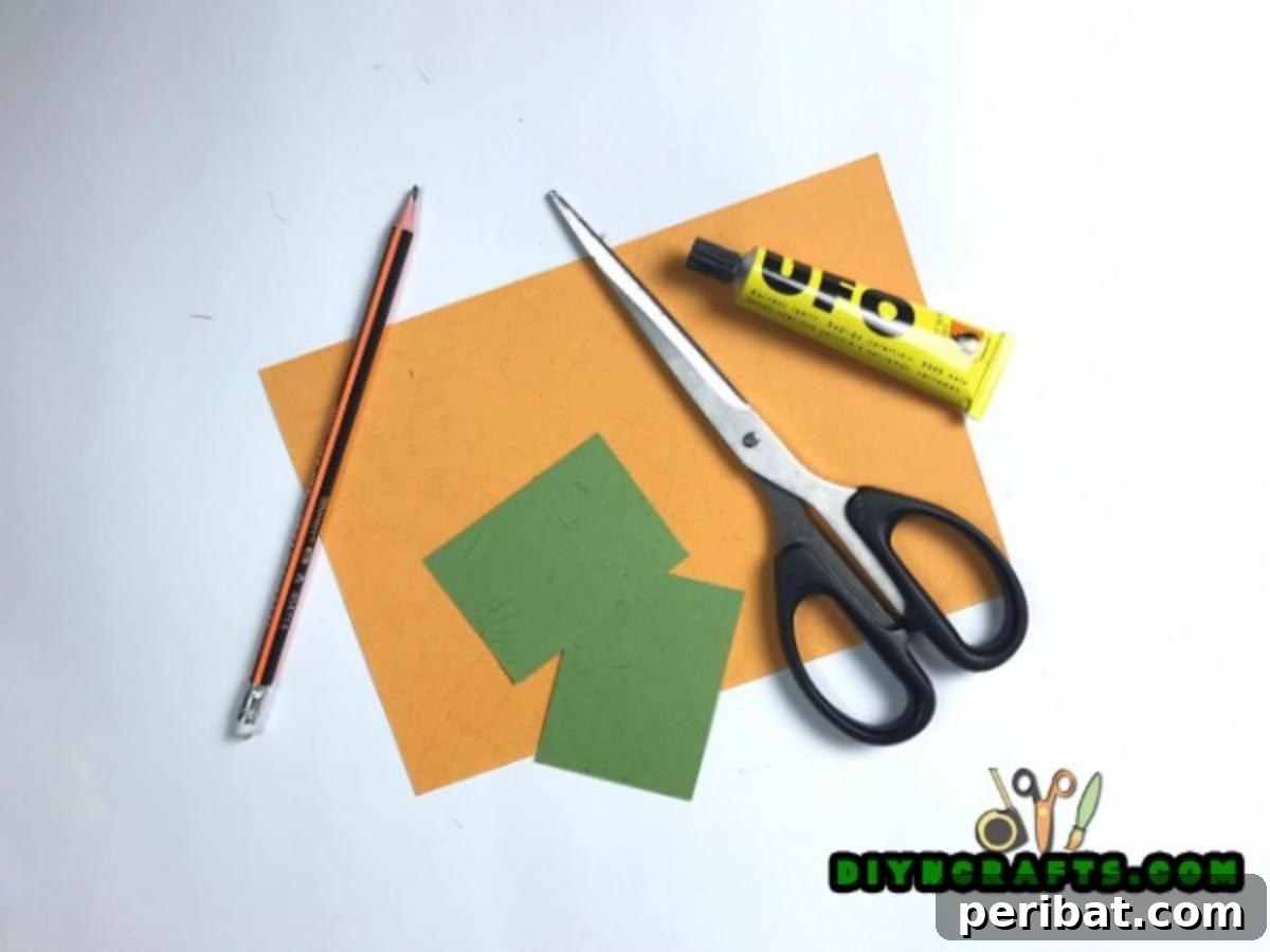 Simple Easter Carrot Box Craft Video 3 Gather simple materials like orange paper, green ribbon, scissors, and glue for your easy DIY Easter carrot box craft.