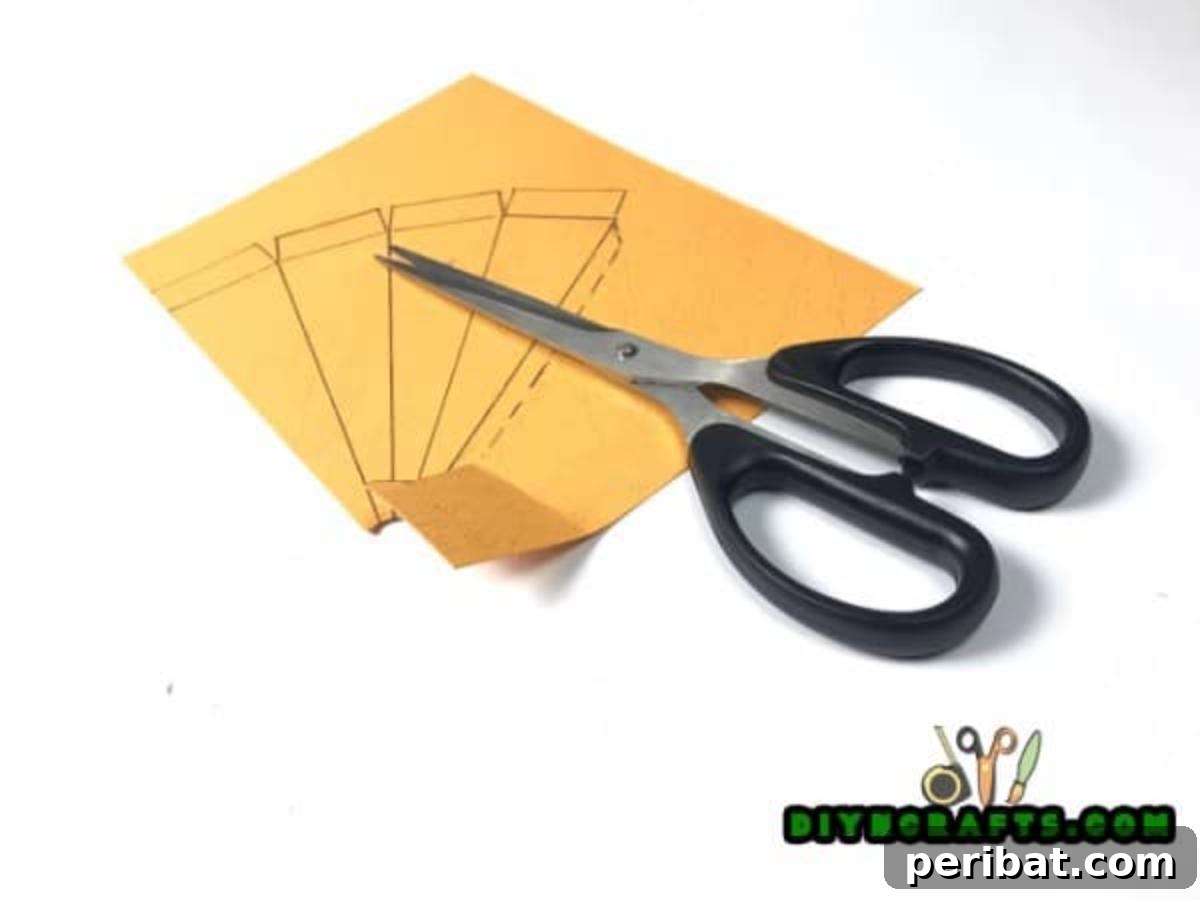 Simple Easter Carrot Box Craft Video 4 Precisely draw the carrot box pattern with a ruler and pencil on orange paper for accurate cutting and folding in this DIY craft.