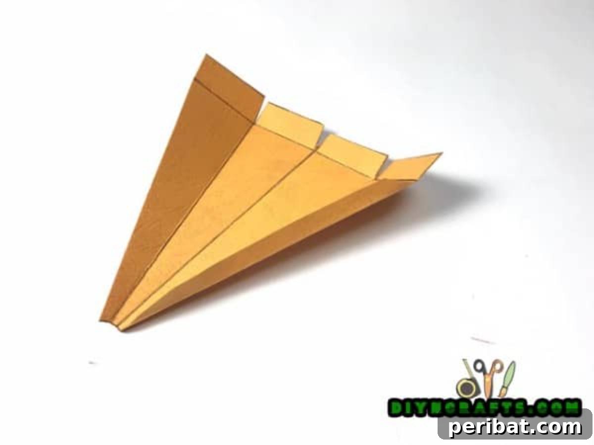 Simple Easter Carrot Box Craft Video 5 Cut the paper carrot box shape, then fold along pre-drawn lines and glue tabs to assemble your unique Easter gift box.