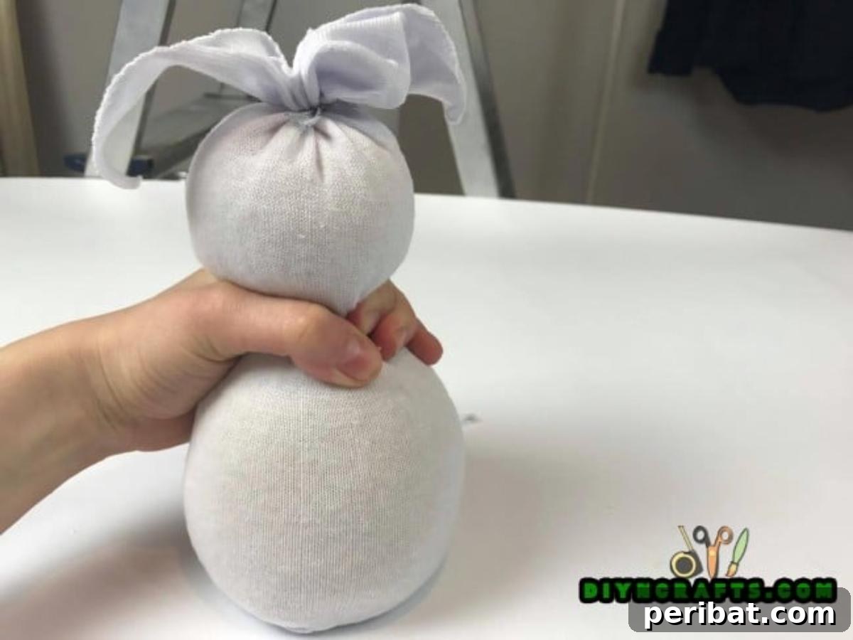 Make an Adorable Easter Bunny with an Old Sock 5 Step 2 - Shaping the ears for your adorable sock bunny craft.