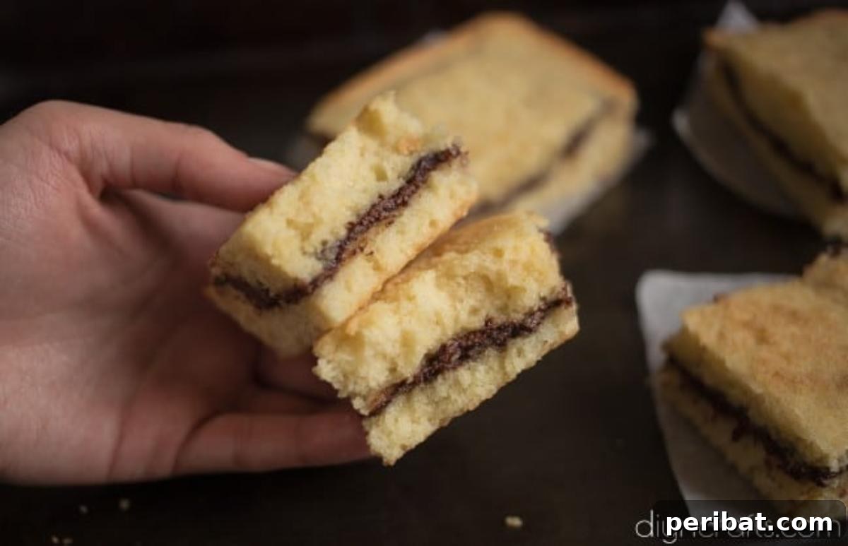 Nutella Stuffed Blondies Your Perfect Anytime Treat 7 Close-up of a sliced Nutella stuffed blondie revealing the delicious center