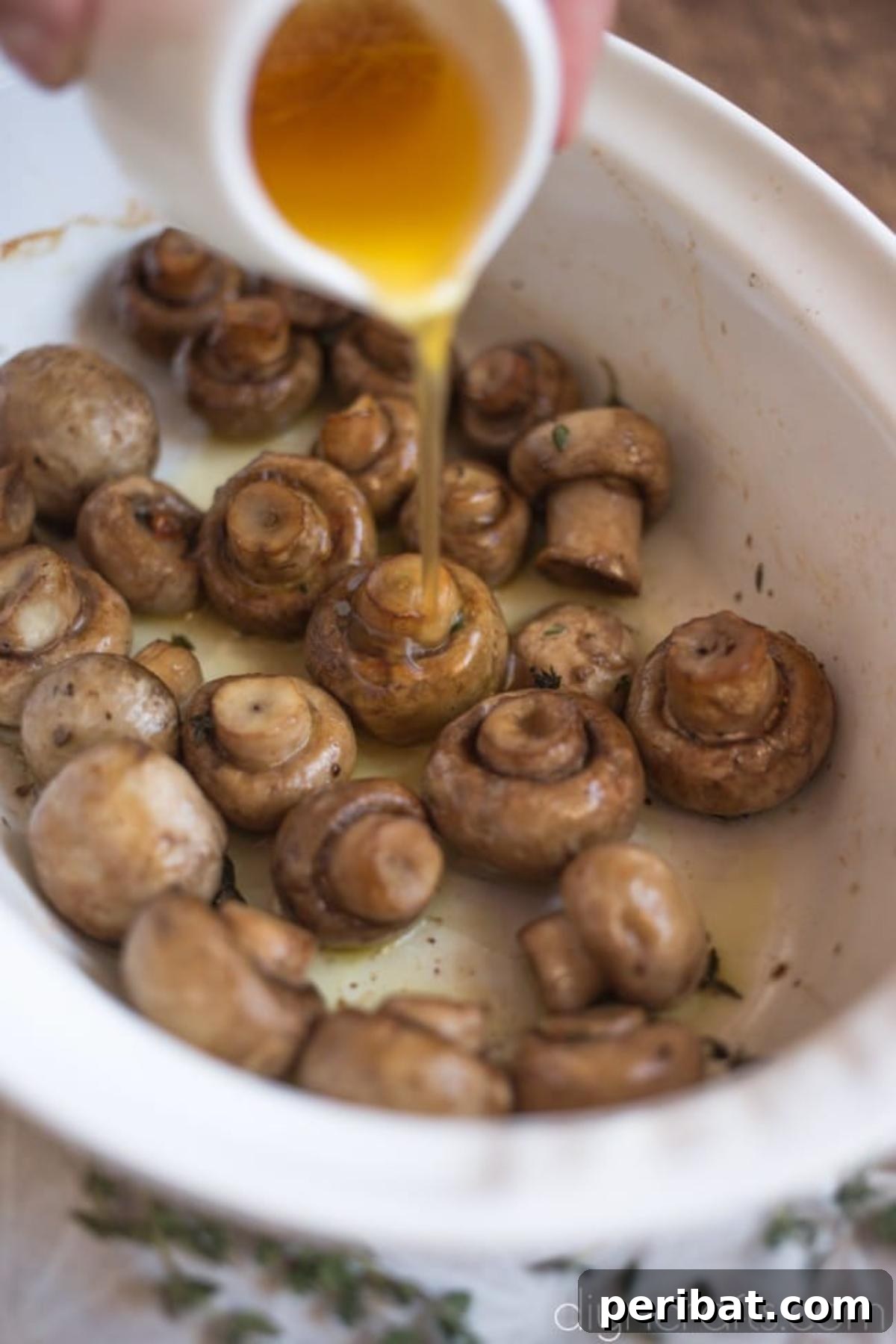 Effortless Elegance Garlic Thyme Roasted Mushrooms 5 Roasted mushrooms are tossed with the delectable browned butter, garlic, and thyme sauce, ensuring every piece is coated.