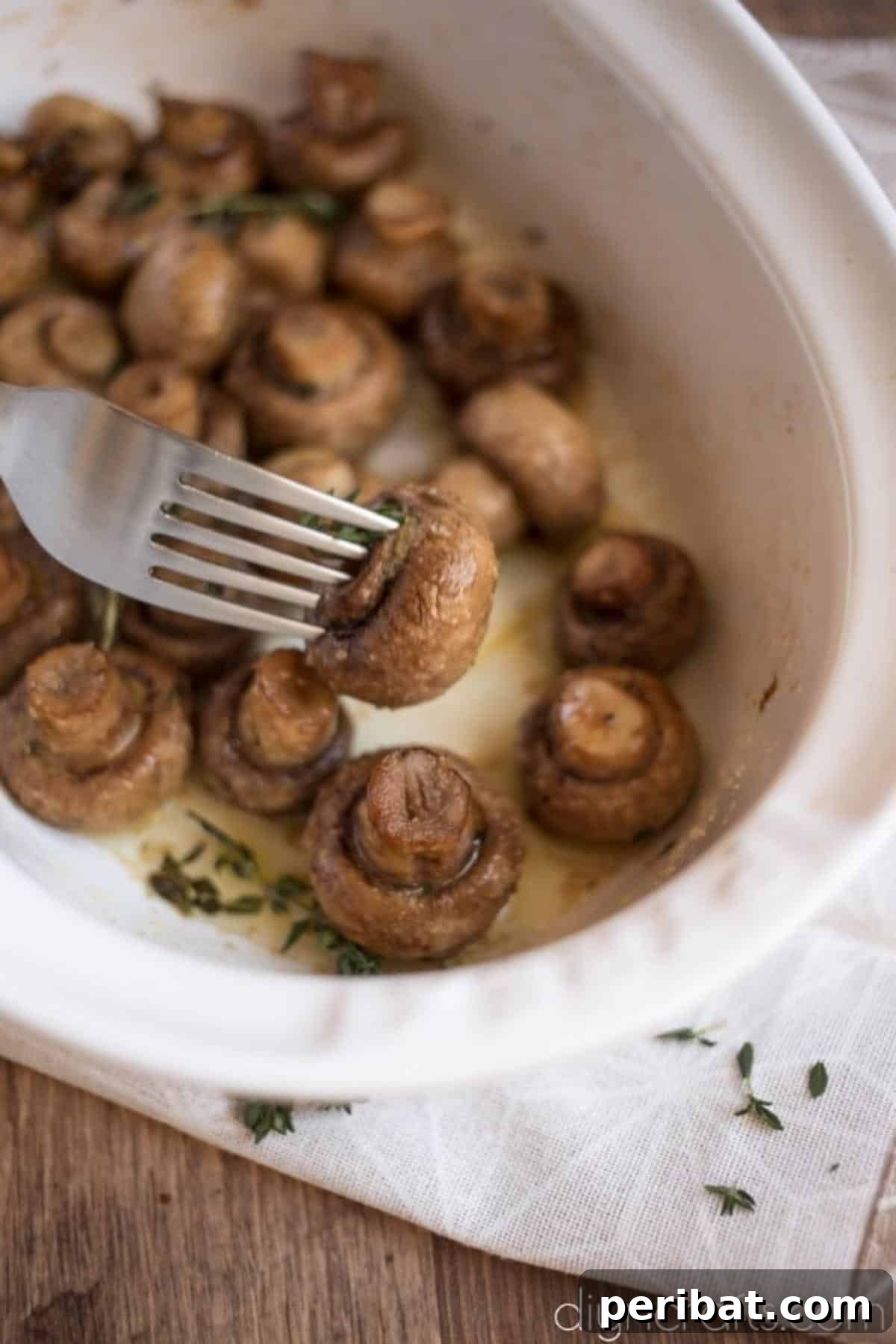 Effortless Elegance Garlic Thyme Roasted Mushrooms 6 The finished Roasted Mushrooms with Garlic and Thyme, glistening with buttery sauce and ready to serve.