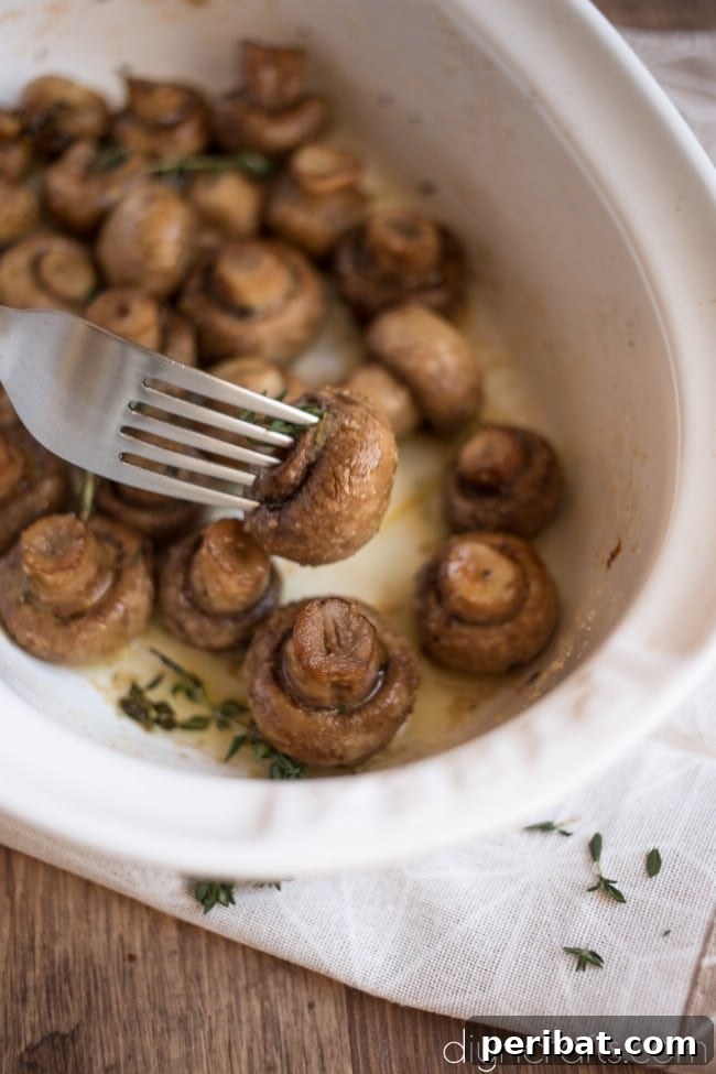 Effortless Elegance Garlic Thyme Roasted Mushrooms 7 An appetizing close-up of Roasted Mushrooms with Garlic and Thyme, perfect for pinning to your favorite recipe board.