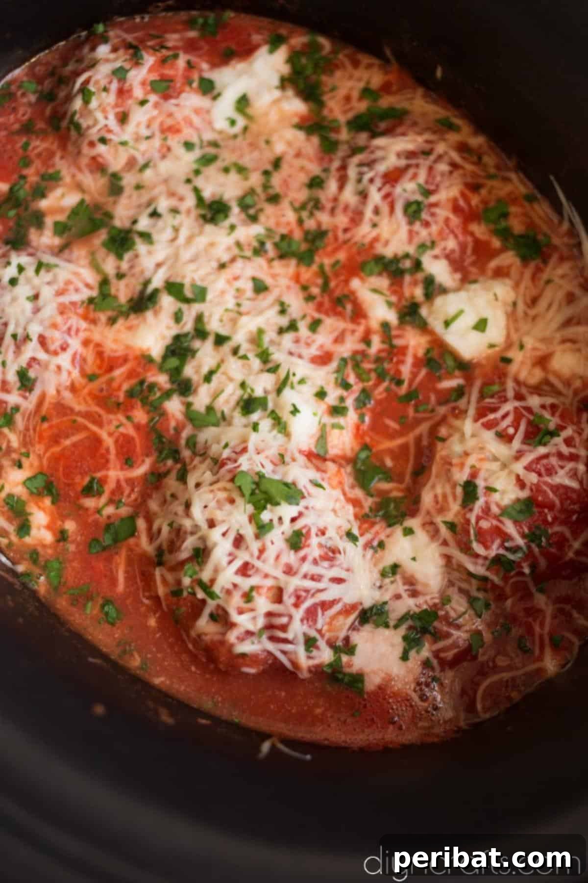 Slow Cooker Mozzarella Meatballs Pasta Night Made Simple 7 Adding cheese and parsley.