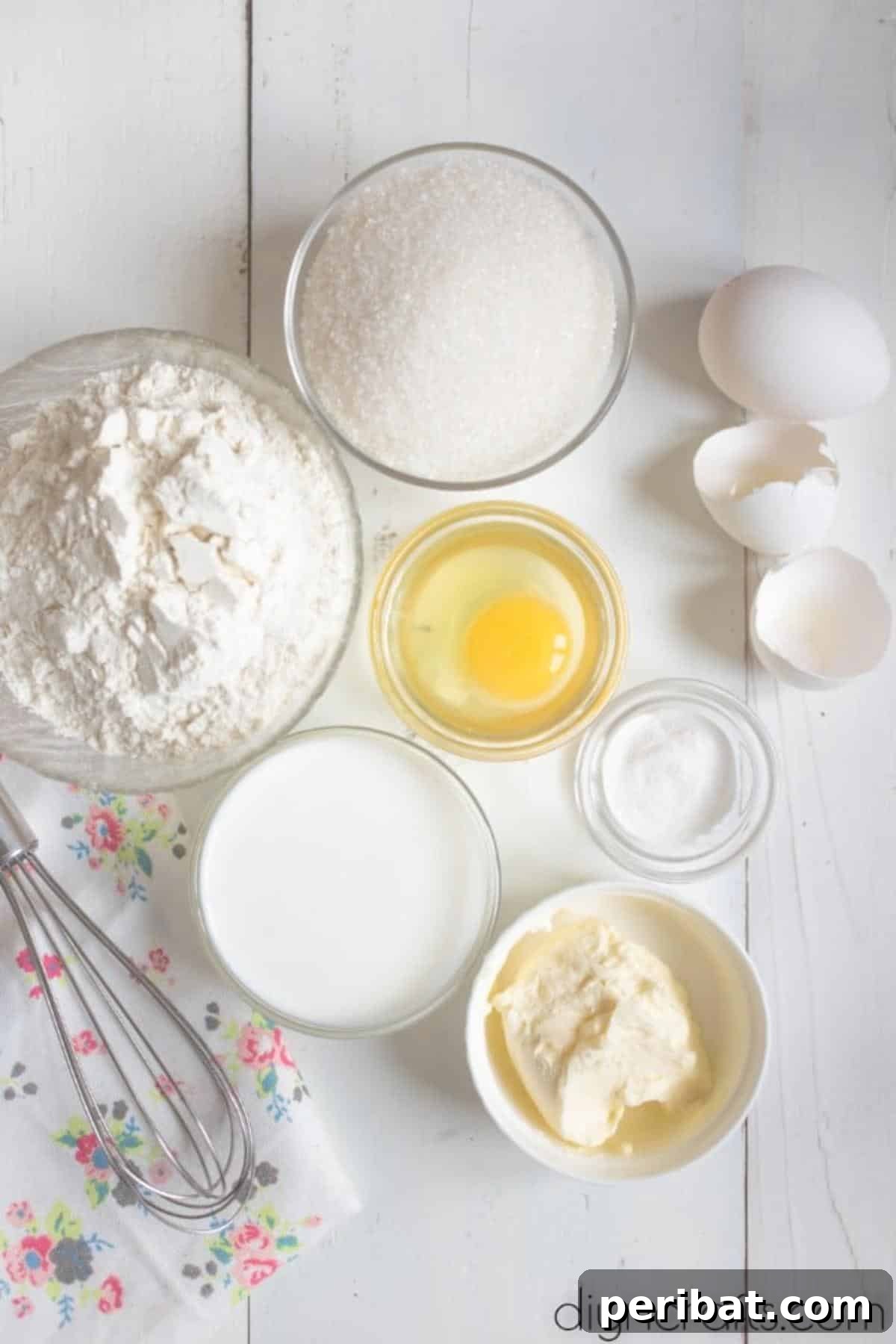 Hem Şirin Hem Lezzetli Paskalya Tavşanı Pastası Tarifi 3 Key ingredients for making the Easter Bunny Cake, including softened butter, eggs, and sugar, laid out on a clean surface ready for baking. These fresh, quality components are essential for a truly homemade flavor.