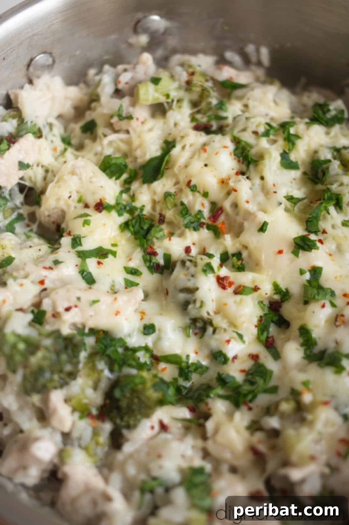 One-Pan Cheesy Chicken and Broccoli Rice Perfection 6 A vibrant and healthy finished recipe of Cheesy Chicken, Broccoli, and Rice in a serving dish