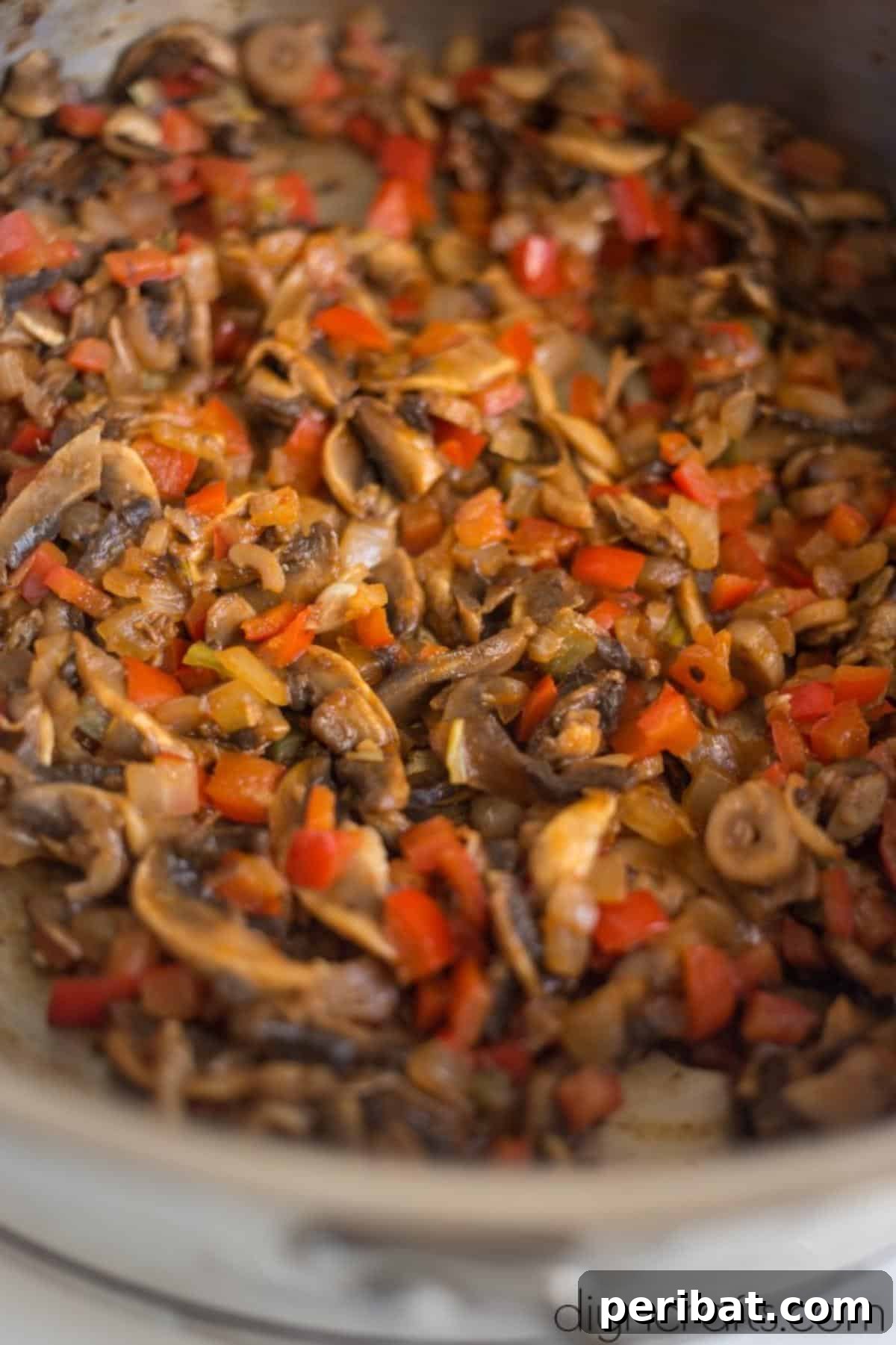 Vegan Burrito Power: High-Protein, Low-Fat Snacking Perfected 5 Sautéing onions, peppers, and mushrooms for the burrito filling.