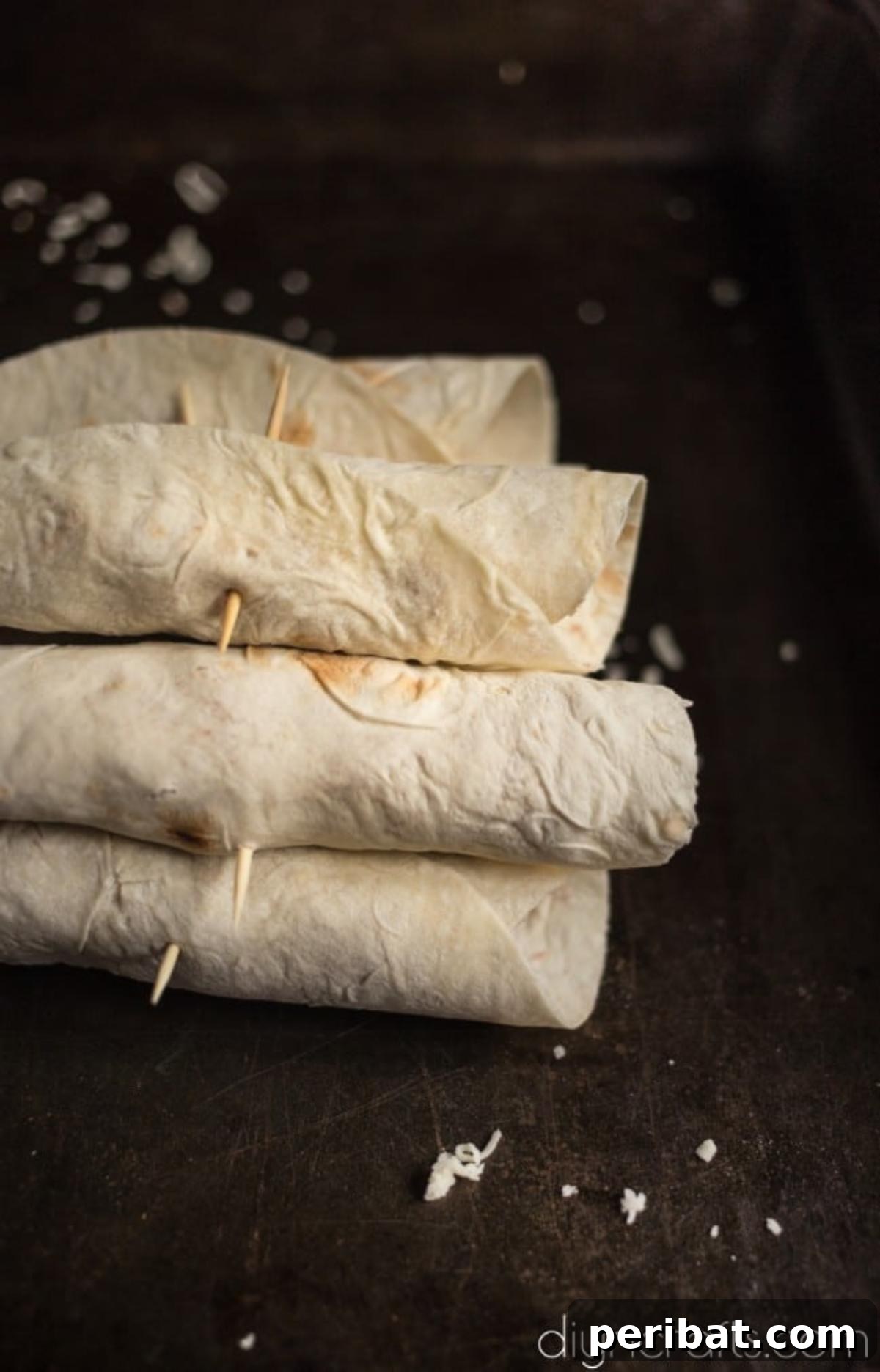 Delicious Black Bean Flautas A Quick and Easy Appetizer 6 Roll tortillas tightly and use a toothpick to secure them together.