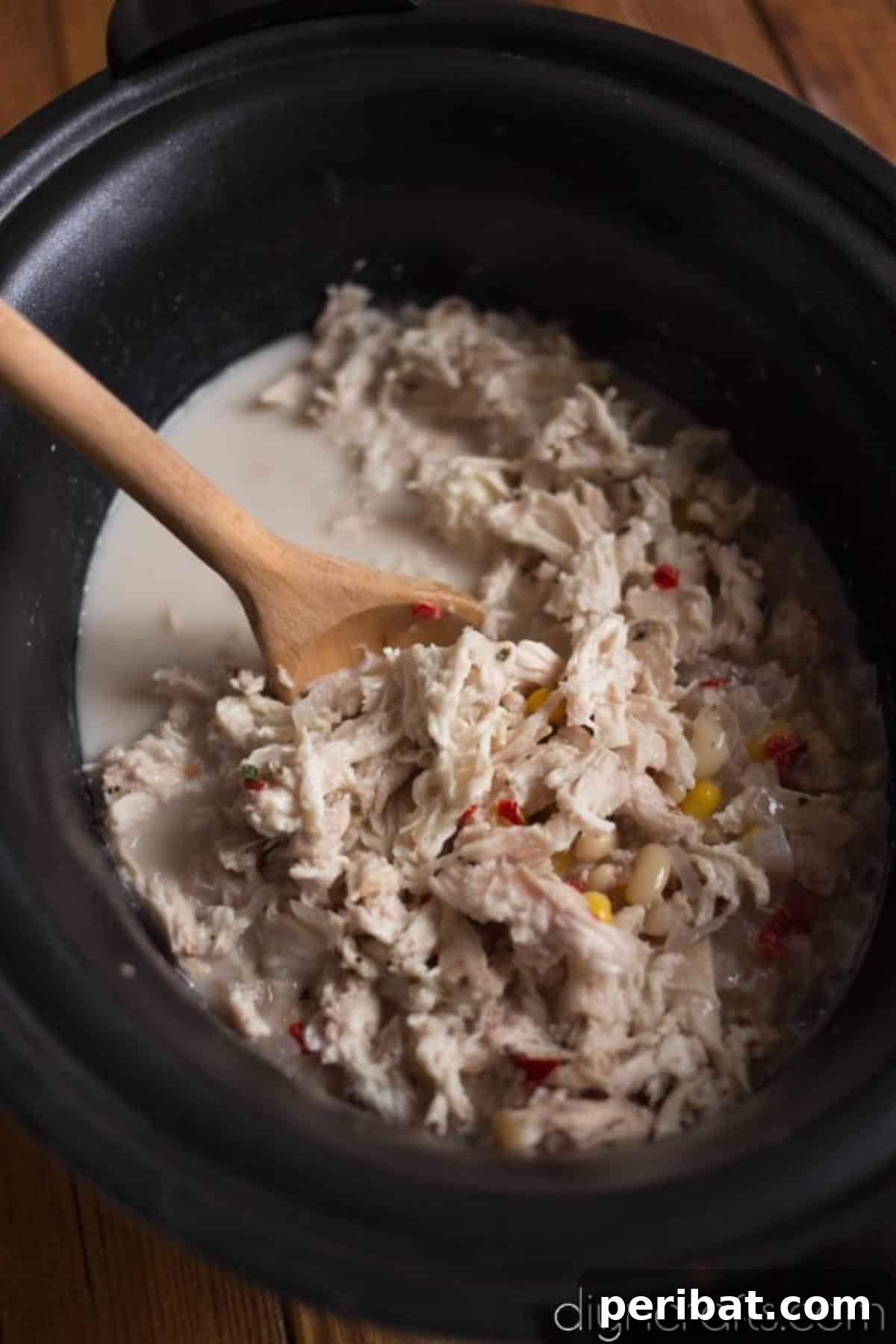 Mixing and adding ingredients to the slow cooker.
