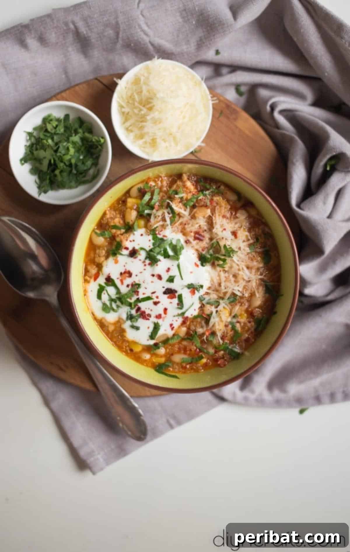Potluck Perfection: A Delicious Quinoa Chili 6 Quinoa Chili Garnished with Sour Cream and Fresh Parsley