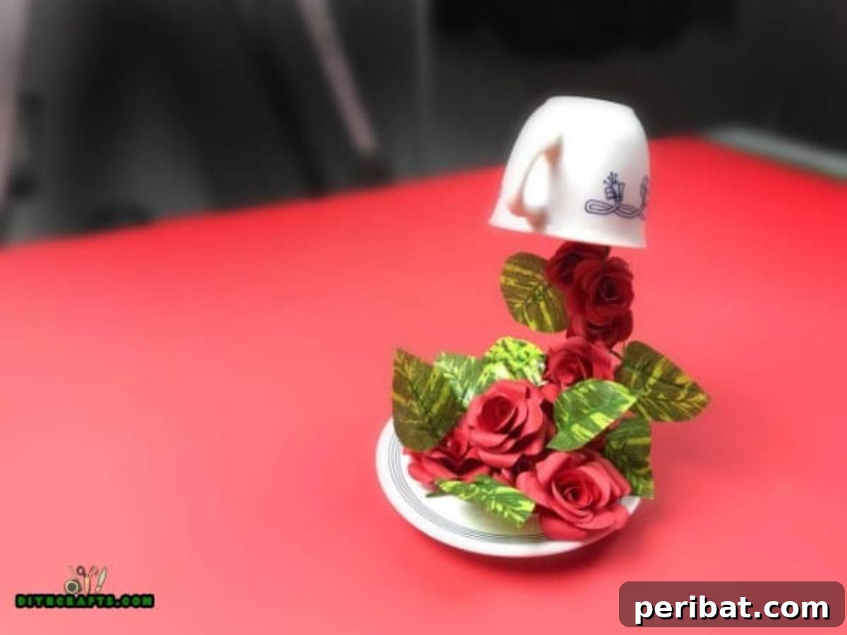 Whimsical Floating Teacup Centerpiece 7 The stunning finished floating flower centerpiece, showcasing a teacup magically suspended over a saucer, overflowing with vibrant artificial flowers.