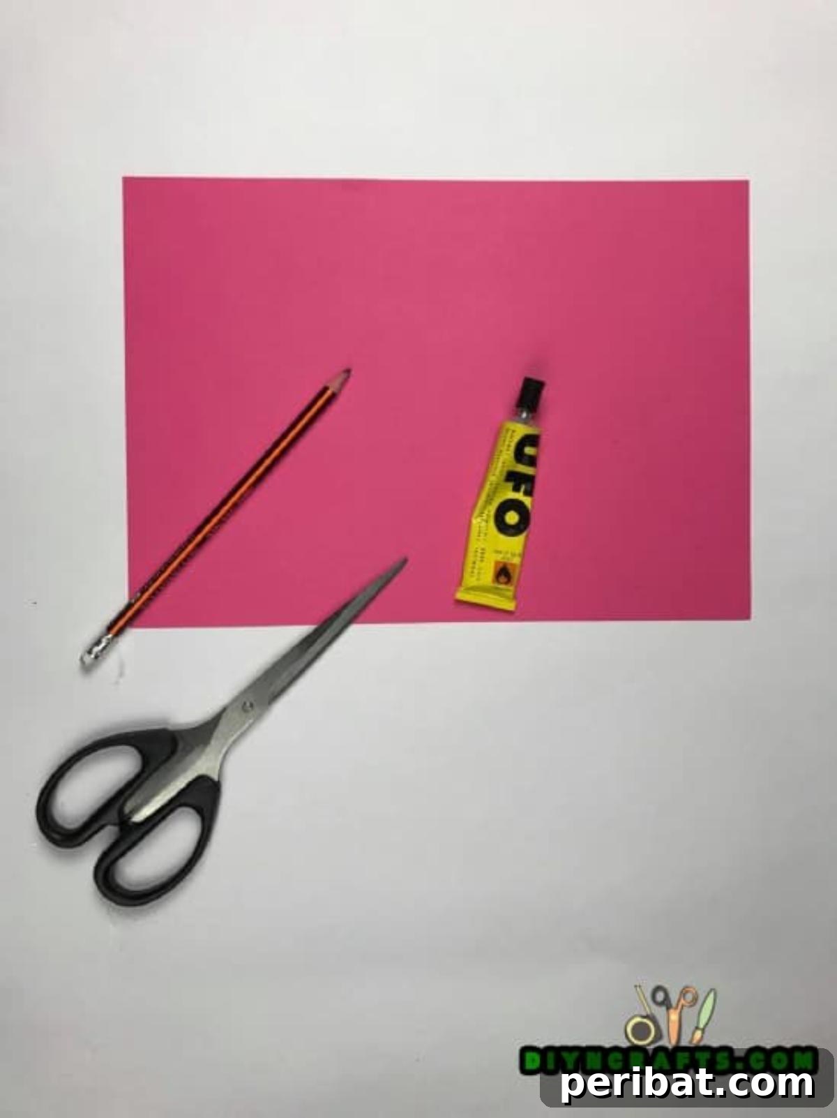 Materials needed for crafting a beautiful paper flower gift topper.