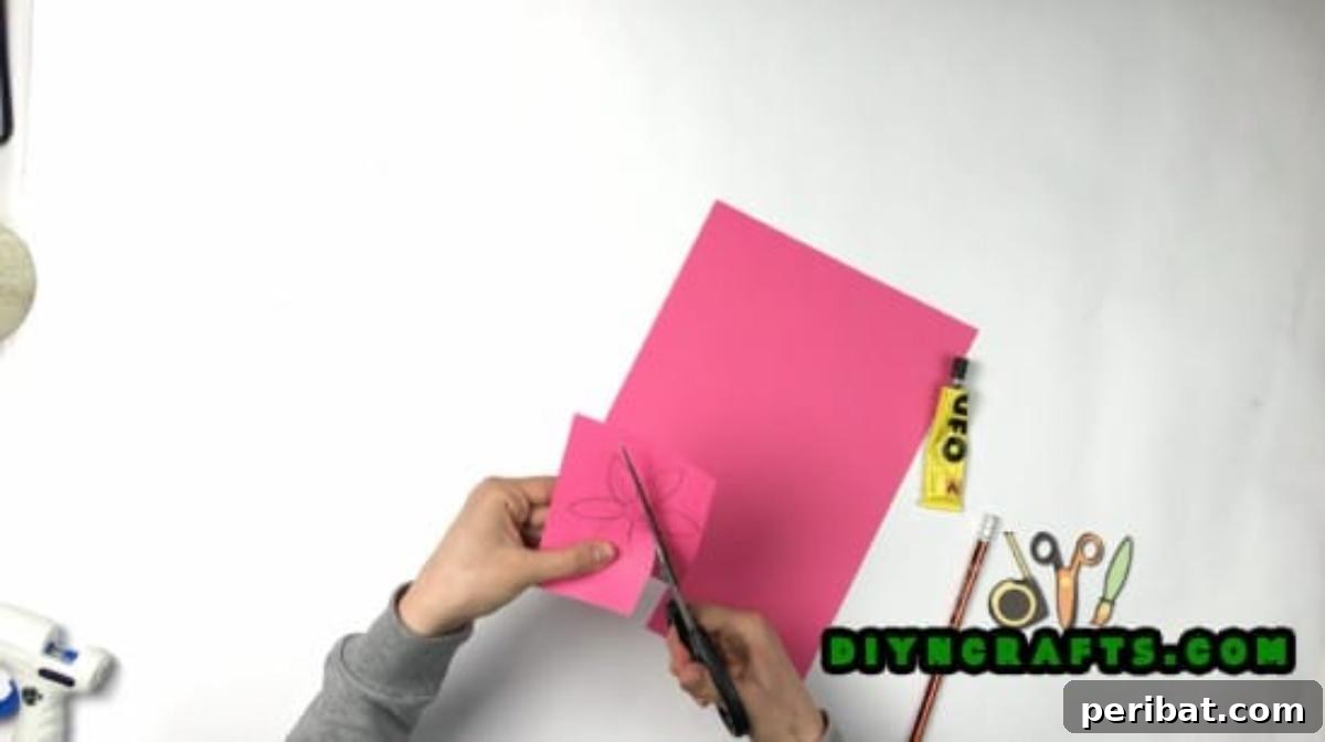 Cutting each paper flower with precision for a clean finish.