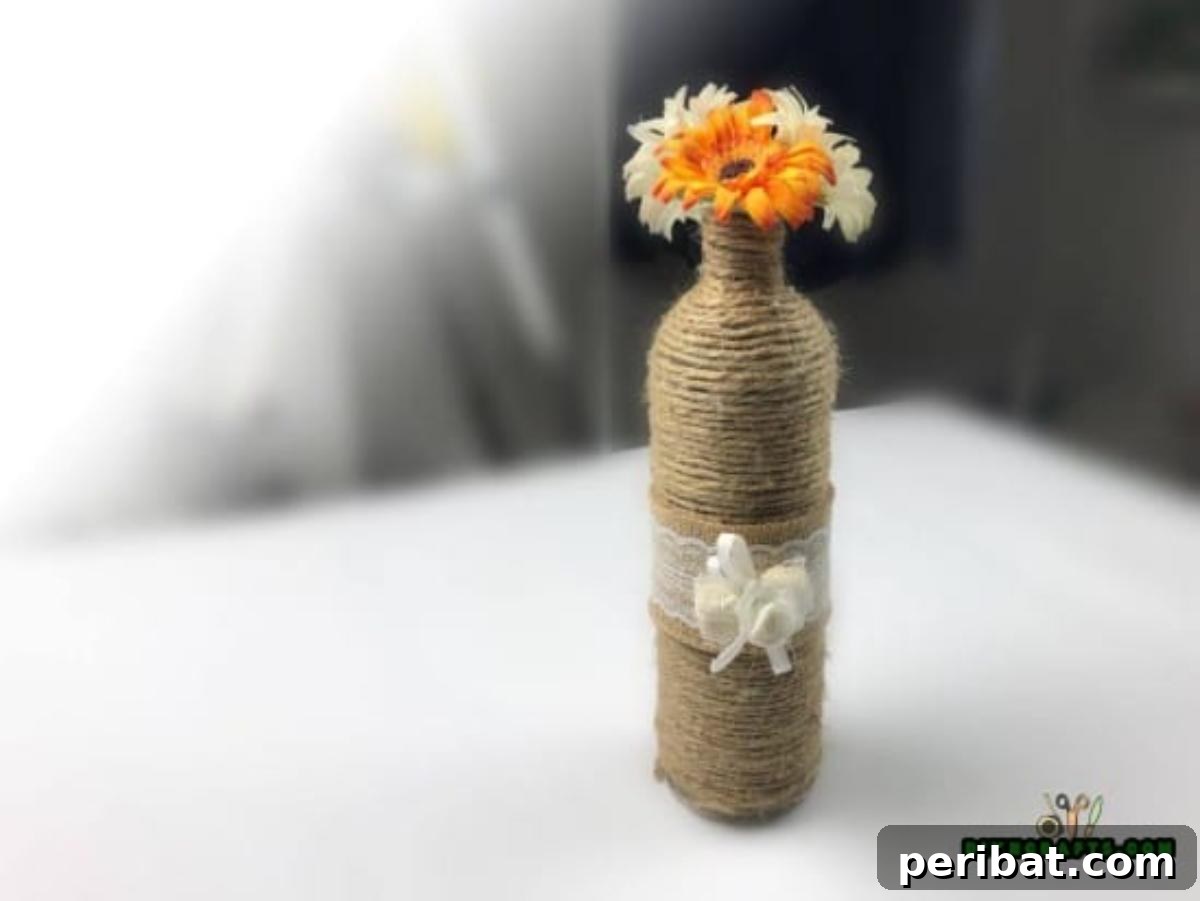 Craft Beautiful Vases from Repurposed Wine Bottles 6 Finished rustic vase with flowers, ready for display.