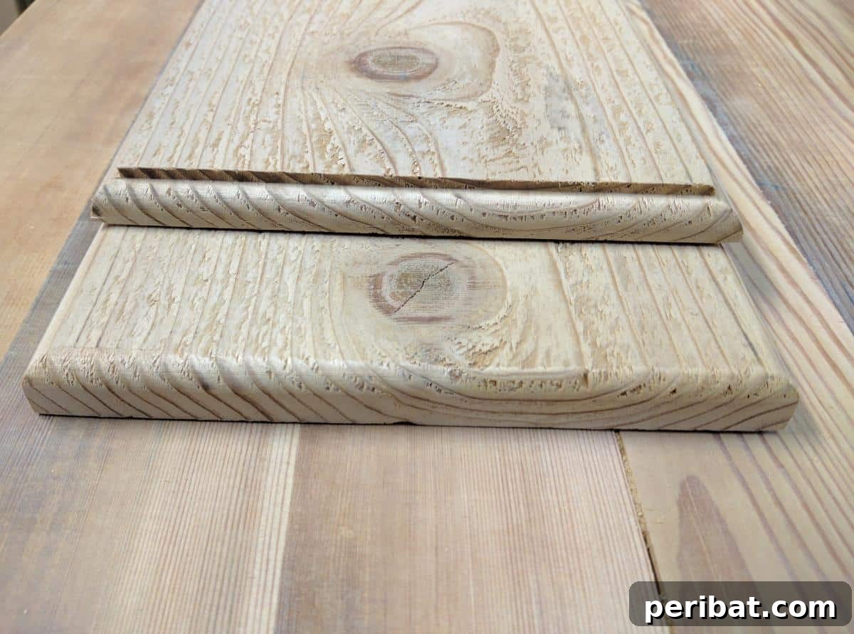 Close-up of the sanded and rounded corner of the wooden bath tray plank.