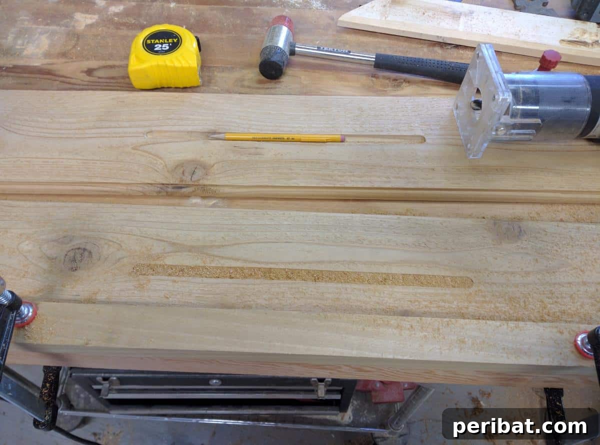 Creating a groove in the wooden bath tray with a router to hold a tablet or mobile device.