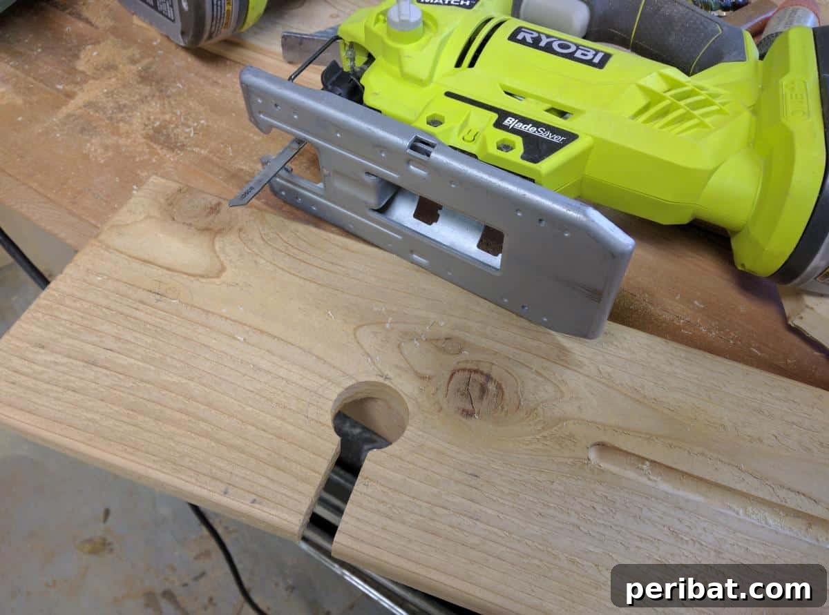 Cutting a specialized channel with a jigsaw to securely hold a wine glass by its stem on the bath tray.