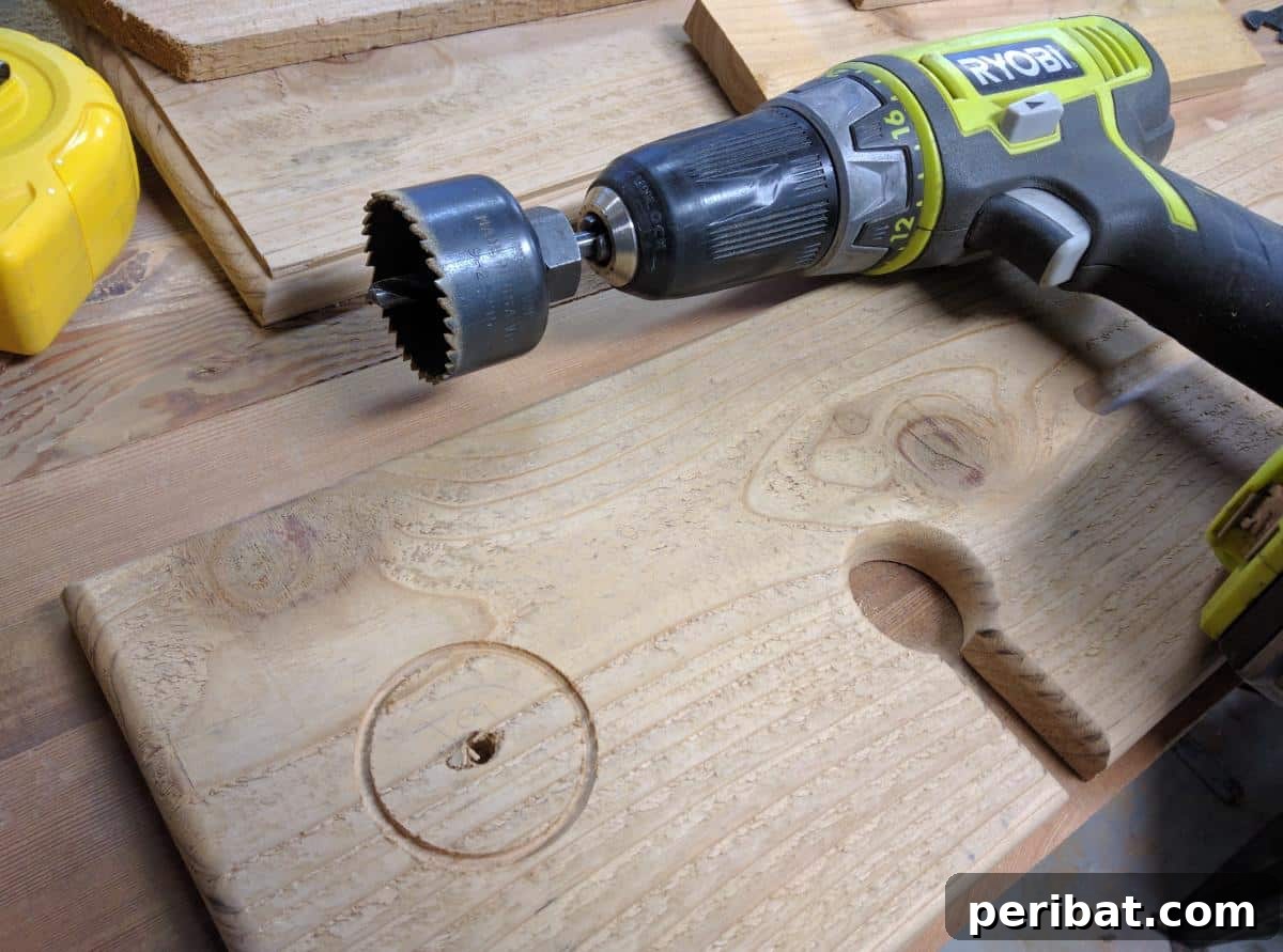 Using a router to create recessed areas in the wooden bath tray designed to hold candles securely.