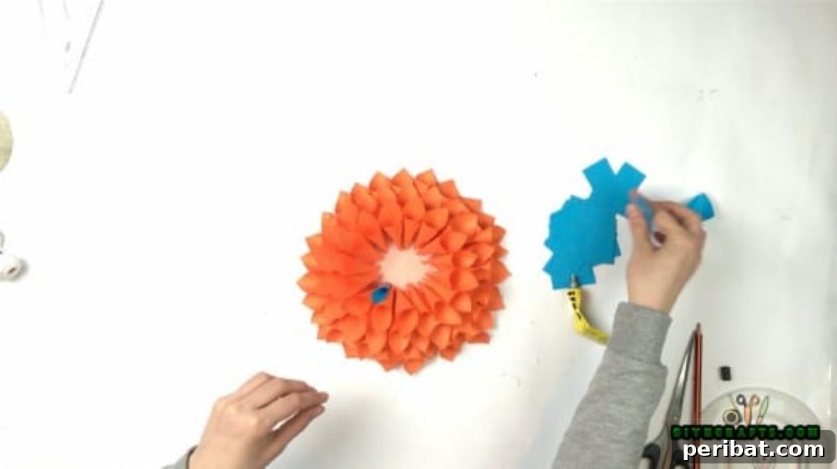 Step 6: Layering paper cones towards the center of the DIY wreath