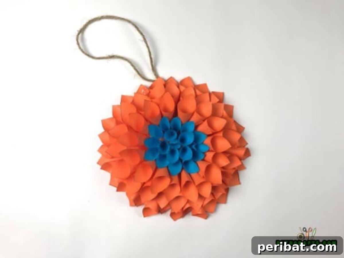 Completed stunning DIY paper flower wreath in orange and blue