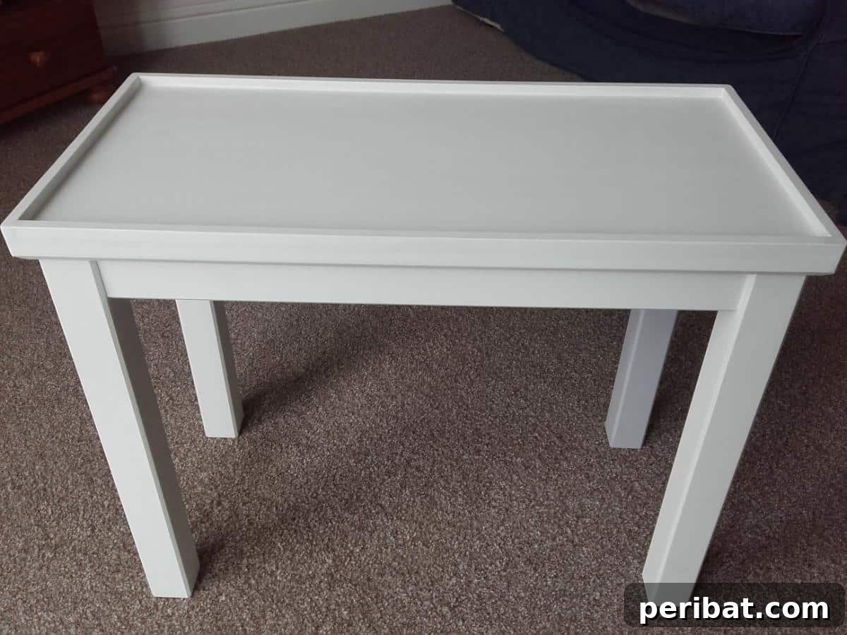 Man Cave Upgrade: Build a Vibrant Bottle Cap Table 6 Painted wooden IKEA table, freshly coated and ready to receive the intricate bottle cap arrangement.