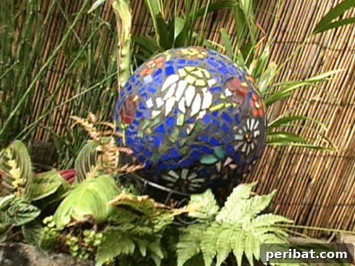 30 Stunning Mosaic Crafts to Enhance Your Indoor and Outdoor Spaces 13 DIY Mosaic Garden Gazing Ball