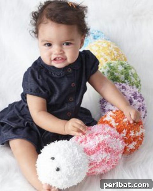Colorful crocheted caterpillar toy for babies