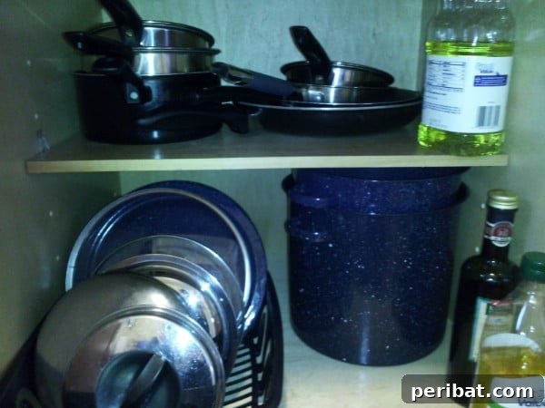 Easy Pan Lid Organization with a Dish Drainer - 150 Dollar Store Organizing Ideas and Projects for the Entire Home