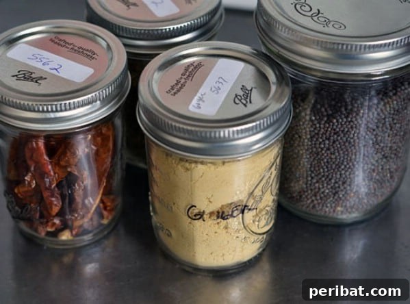 Attractive and Organized Spice Cabinet - 150 Dollar Store Organizing Ideas and Projects for the Entire Home