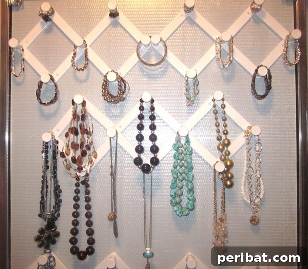 Accordion Hooks for Organizing Jewelry - 150 Dollar Store Organizing Ideas and Projects for the Entire Home