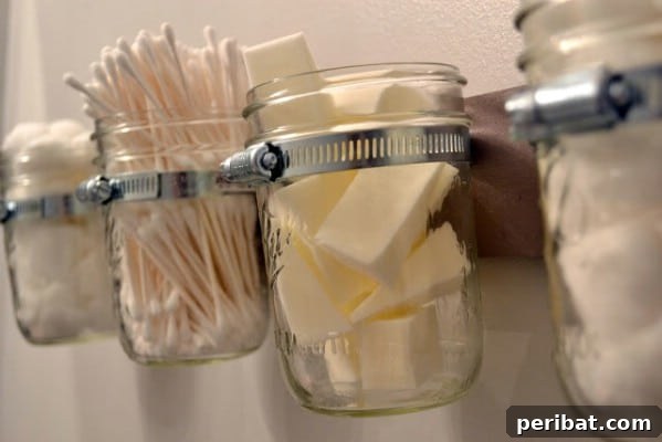 Mounted Mason Jars Add Extra Storage - 150 Dollar Store Organizing Ideas and Projects for the Entire Home