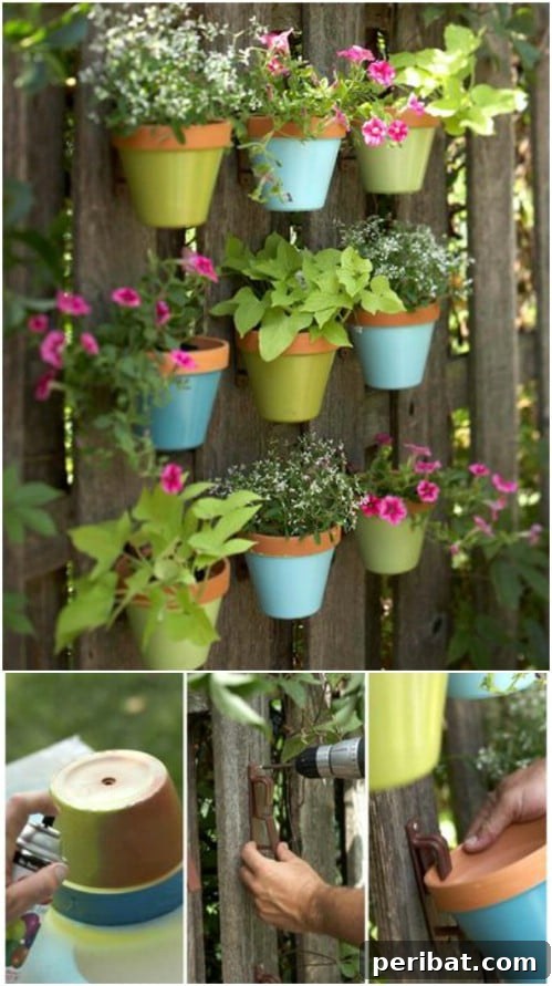 Stunning Fence Decor Ideas to Beautify Your Yard 17 Painted Terra Cotta Plant Hangers on a Fence