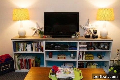 30 Ingenious Bookcase Upcycle Projects 32 Bookcase Turned TV Stand with integrated storage.